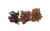 Dark brown beads, light brown beads and blonde beads scattered in piles beside eachother to show color difference